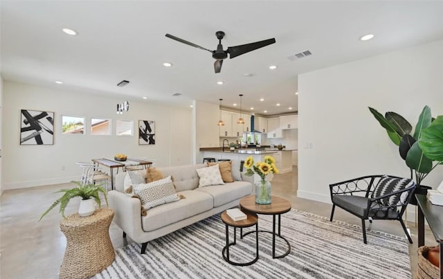 7306 Carver Ave Unit 1, Austin, TX 78752 - living area with concrete floors, recessed lighting, and ceiling fan