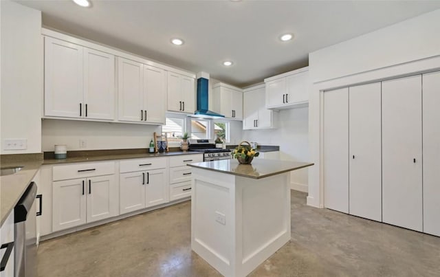 7306 Carver Ave Unit 1, Austin, TX 78752 - kitchen with stainless steel appliances, finished concrete floors, wall chimney range hood, white cabinetry, and recessed lighting