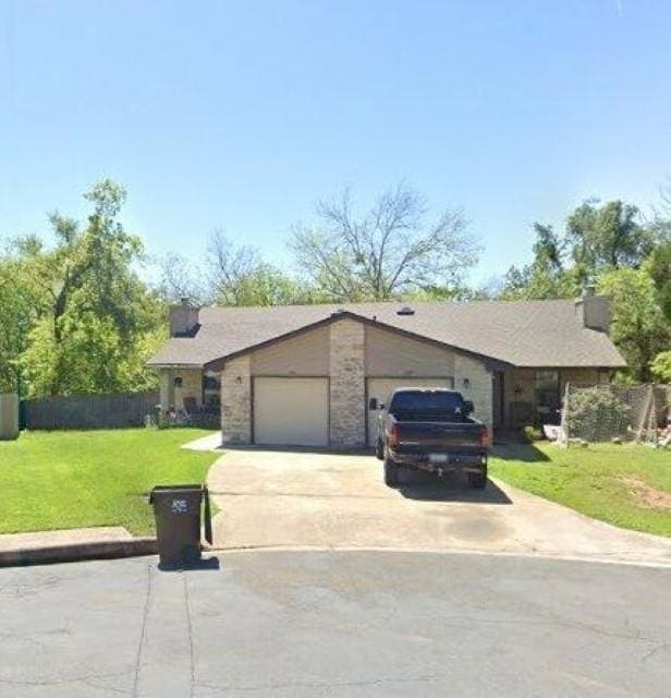 2305 Pena Cv, Round Rock, TX 78681 - view of front of house featuring a garage and driveway