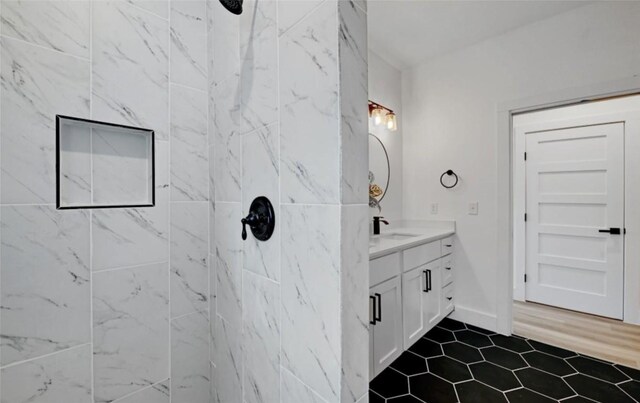7613 Providence Ave Unit 1, Austin, TX 78752 - full bath featuring vanity, tiled shower, and tile patterned floors