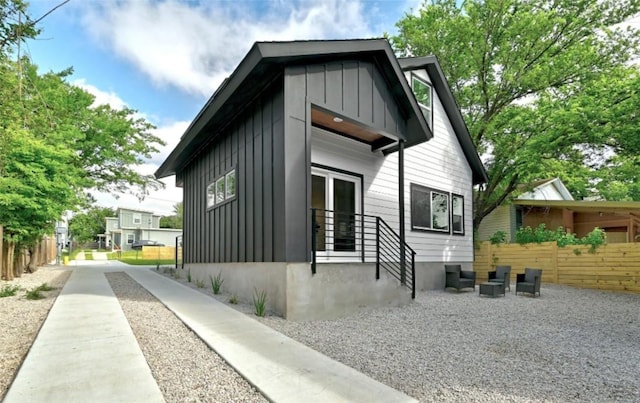7613 Providence Ave Unit 1, Austin, TX 78752 - view of side of home with board and batten siding and driveway