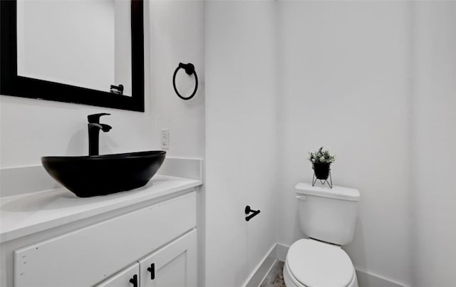 7613 Providence Ave Unit 1, Austin, TX 78752 - bathroom with baseboards and vanity