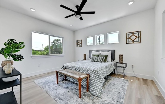 7613 Providence Ave Unit 1, Austin, TX 78752 - bedroom with multiple windows, recessed lighting, wood finished floors, and ceiling fan