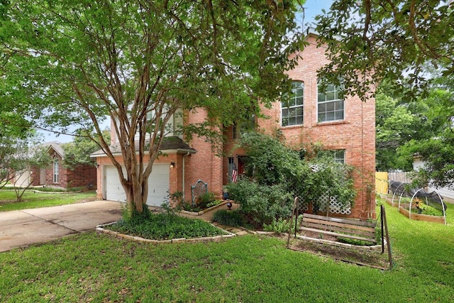 1306 River Oak Dr, Leander, TX 78641 - view of property hidden behind natural elements with brick siding, a front yard, concrete driveway, an attached garage, and a garden