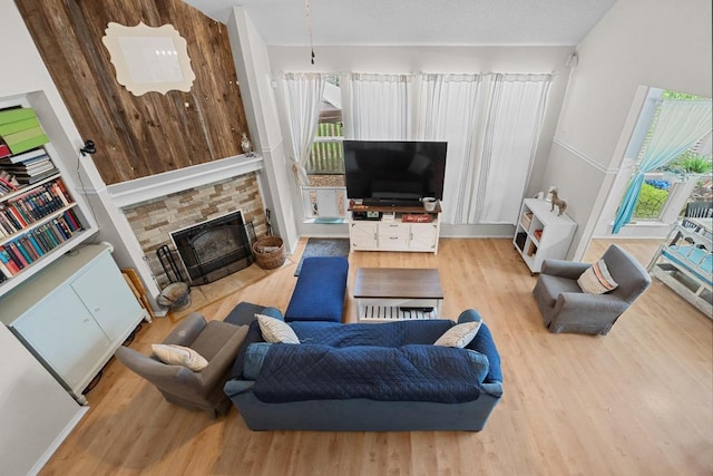 1306 River Oak Dr, Leander, TX 78641 - living room with wood finished floors and a fireplace