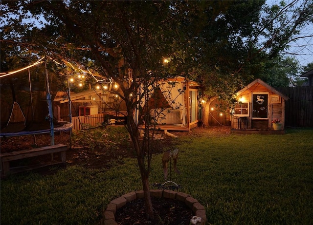 1306 River Oak Dr, Leander, TX 78641 - view of yard featuring a trampoline and an outbuilding