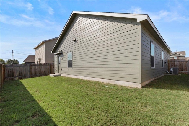 14320 Tordillo Dr, Elgin, TX 78621 - view of side of home featuring a fenced backyard and a central air condition unit