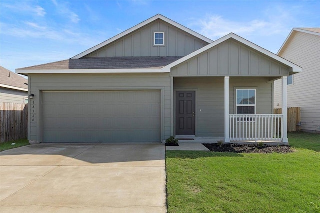14320 Tordillo Dr, Elgin, TX 78621 - view of front of property with board and batten siding, a porch, an attached garage, driveway, and roof with shingles