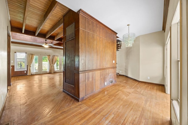 1001 S Gabriel Dr, Leander, TX 78641 - unfurnished room with light wood-style flooring, a chandelier, and beamed ceiling