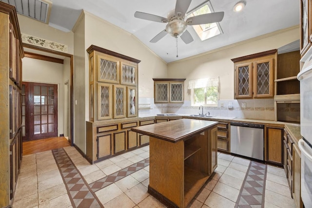 1001 S Gabriel Dr, Leander, TX 78641 - kitchen featuring stainless steel dishwasher, open shelves, tasteful backsplash, a ceiling fan, and ornamental molding