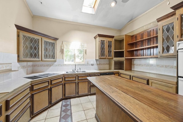 1001 S Gabriel Dr, Leander, TX 78641 - kitchen featuring a skylight, open shelves, backsplash, ornamental molding, and vaulted ceiling