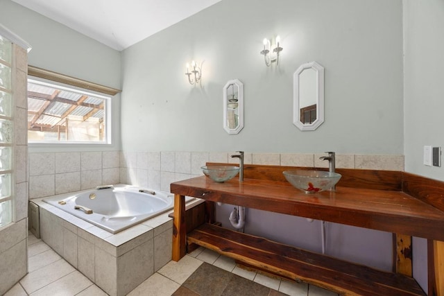 1001 S Gabriel Dr, Leander, TX 78641 - bathroom featuring a bath, tile patterned flooring, and double vanity