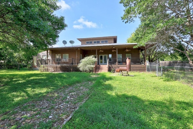 1001 S Gabriel Dr, Leander, TX 78641 - rear view of house with french doors, a ceiling fan, a fenced backyard, a wooden deck, and a metal roof