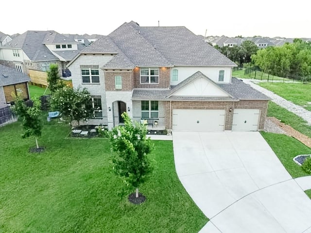2616 Pine Branch Rd, Leander, TX 78641 - french country inspired facade with concrete driveway, a garage, brick siding, and a residential view