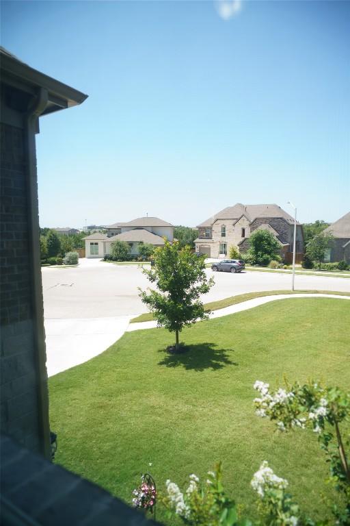 2616 Pine Branch Rd, Leander, TX 78641 - view of green lawn featuring a residential view