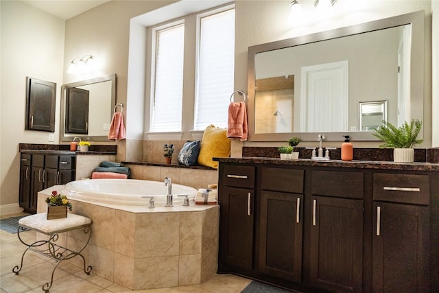 2616 Pine Branch Rd, Leander, TX 78641 - full bathroom with tile patterned floors, two vanities, and a garden tub