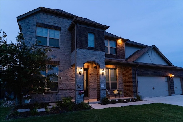 2616 Pine Branch Rd, Leander, TX 78641 - view of front of property with an attached garage, stone siding, concrete driveway, and a front yard