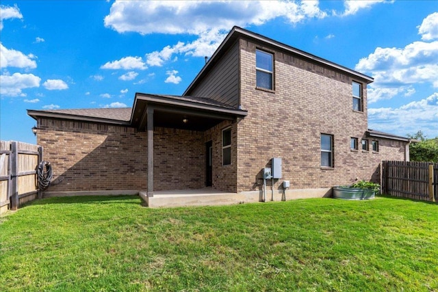 1629 W Broade St, Leander, TX 78641 - back of property with a patio, a fenced backyard, and brick siding