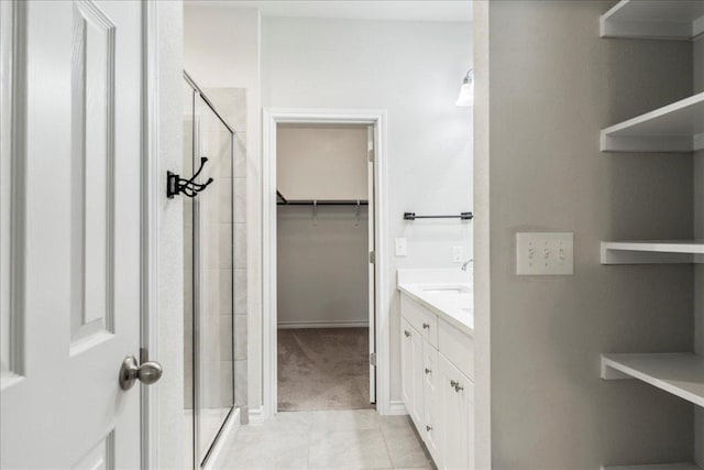1629 W Broade St, Leander, TX 78641 - bathroom with a shower stall, a walk in closet, tile patterned flooring, and vanity