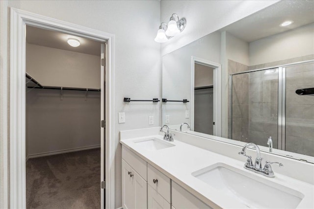 1629 W Broade St, Leander, TX 78641 - bathroom featuring double vanity, a walk in closet, and a stall shower
