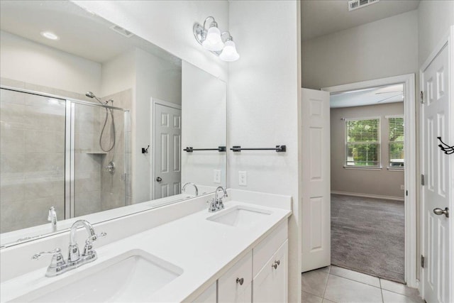1629 W Broade St, Leander, TX 78641 - full bath featuring tile patterned flooring, a shower stall, and double vanity