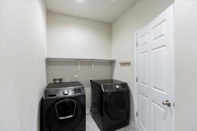 1629 W Broade St, Leander, TX 78641 - washroom with washing machine and dryer and baseboards