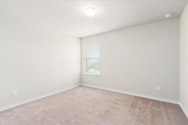 1629 W Broade St, Leander, TX 78641 - empty room featuring carpet flooring and a smoke detector