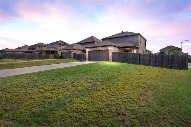 1629 W Broade St, Leander, TX 78641 - view of front facade featuring concrete driveway, an attached garage, and brick siding