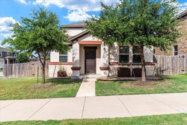 1629 W Broade St, Leander, TX 78641 - obstructed view of property with stone siding and stucco siding