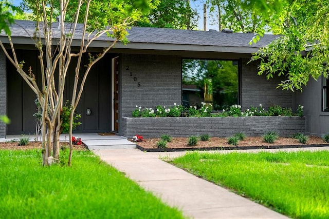 2105 Brunswick, Austin, TX 78723 - view of front of property featuring brick siding and a front lawn