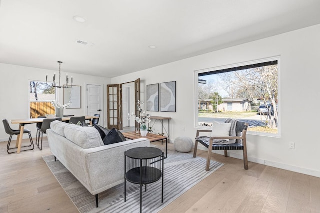 2105 Brunswick, Austin, TX 78723 - living area featuring a chandelier, light wood finished floors, and recessed lighting