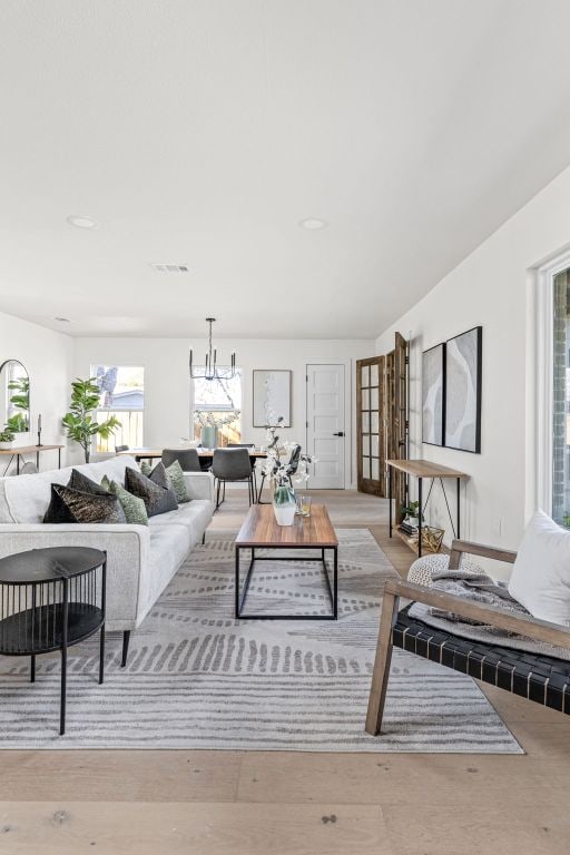 2105 Brunswick, Austin, TX 78723 - living room with a chandelier, wood finished floors, and recessed lighting
