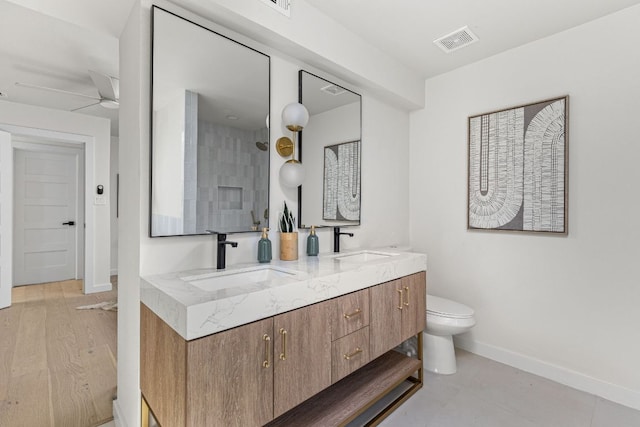 2105 Brunswick, Austin, TX 78723 - bathroom featuring double vanity, a ceiling fan, and a shower