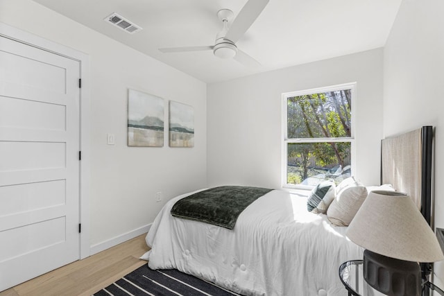 2105 Brunswick, Austin, TX 78723 - bedroom featuring wood finished floors and a ceiling fan