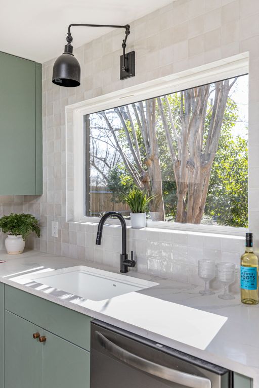 2105 Brunswick, Austin, TX 78723 - kitchen featuring dishwasher, decorative backsplash, and light countertops