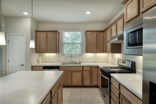 502 Saratoga Ln, Georgetown, TX 78633 - kitchen featuring stainless steel appliances, under cabinet range hood, light countertops, recessed lighting, and light tile patterned floors