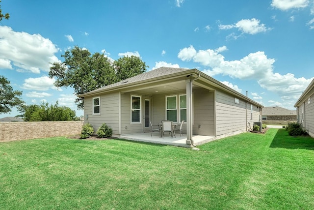 502 Saratoga Ln, Georgetown, TX 78633 - back of property featuring a patio and a lawn