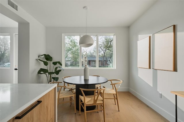 7516 Northcrest Blvd Unit 1, Austin, TX 78752 - dining space with light wood-style flooring and baseboards