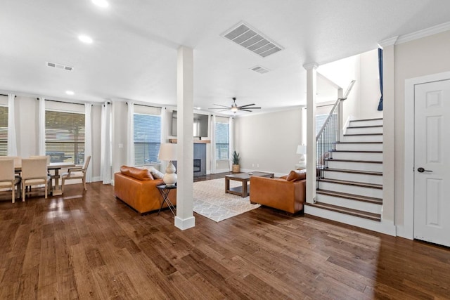 104 Hazeltine Dr, Georgetown, TX 78628 - living room featuring a ceiling fan, dark wood-type flooring, recessed lighting, plenty of natural light, and crown molding