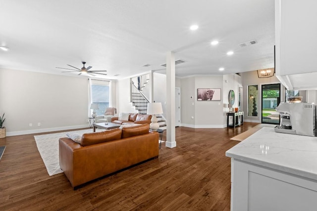 104 Hazeltine Dr, Georgetown, TX 78628 - living area with stairs, healthy amount of natural light, dark wood-style flooring, and recessed lighting