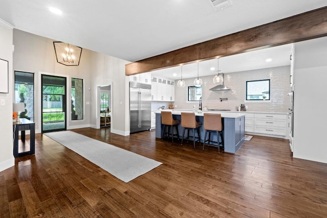 104 Hazeltine Dr, Georgetown, TX 78628 - living area with dark wood-style flooring, plenty of natural light, and recessed lighting