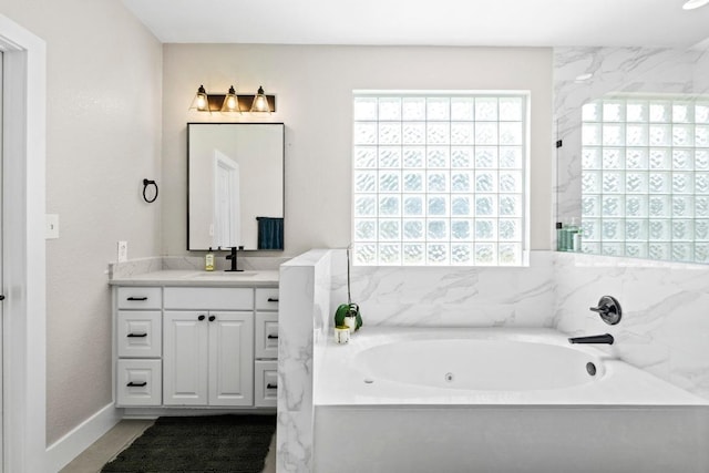 104 Hazeltine Dr, Georgetown, TX 78628 - full bathroom with a whirlpool tub and vanity