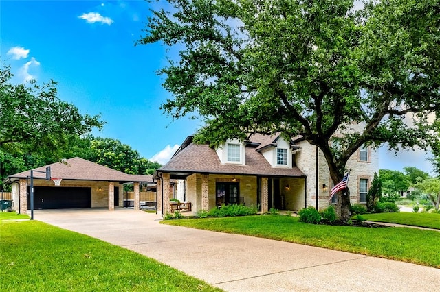 104 Hazeltine Dr, Georgetown, TX 78628 - view of front facade featuring a front lawn, driveway, a porch, an attached garage, and brick siding