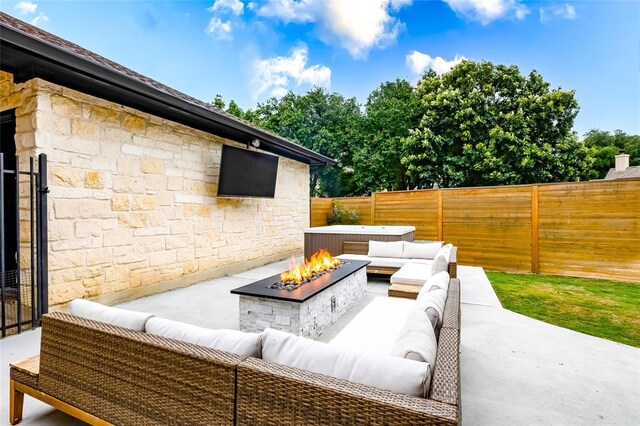 104 Hazeltine Dr, Georgetown, TX 78628 - fenced backyard with an outdoor living space with a fire pit and a patio area
