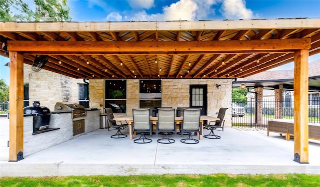104 Hazeltine Dr, Georgetown, TX 78628 - view of patio with exterior kitchen and outdoor dining space