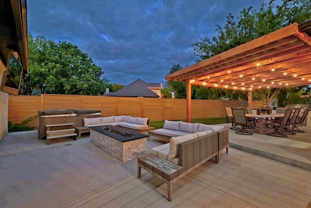 104 Hazeltine Dr, Georgetown, TX 78628 - fenced backyard featuring a patio, an outdoor living space with a fire pit, a hot tub, and outdoor dining space