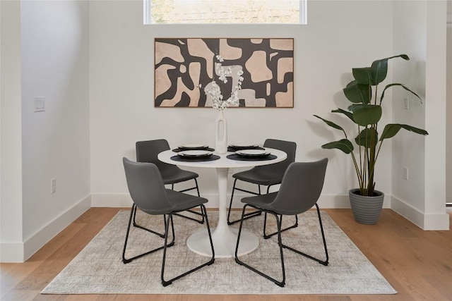 7516 Northcrest Blvd Unit 2, Austin, TX 78752 - dining area featuring wood finished floors and plenty of natural light