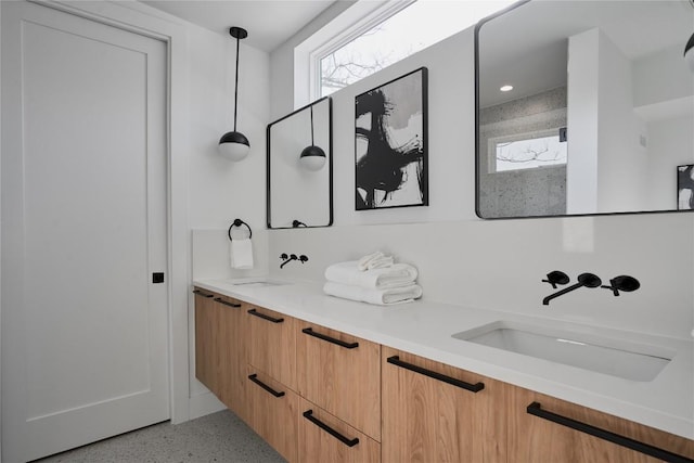 7516 Northcrest Blvd Unit 2, Austin, TX 78752 - bathroom featuring speckle patterned floor and double vanity