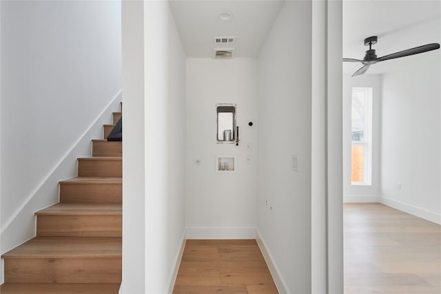 7516 Northcrest Blvd Unit 2, Austin, TX 78752 - staircase featuring wood finished floors and ceiling fan