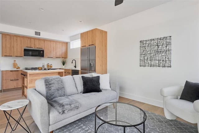 7516 Northcrest Blvd Unit 2, Austin, TX 78752 - living area with light wood-type flooring and baseboards